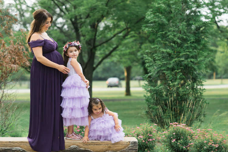 I was thrilled when Michelle from Pink Comb Studio reached out for her maternity photos. Following COVID-19 rule, keeping social distance I photographed Michelle and her two beautiful girls at Watchung Mountain NJ. With overcast weather three trees and grass showed such a rich deep green colors. I love bold rich colors in my photos as much as I love sunset golden hour. Michelle was just glowing and looked so beautiful. Was so happy to have such a beautiful mama in front of my camera before Michelle becomes mama of three girls. I can not wait to see her new baby girl and see her family grow. Michelle Surgent’s maternity session captured by Karis from heykaris.